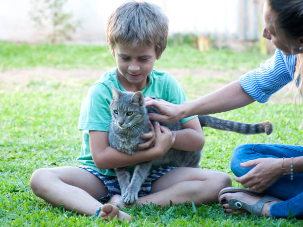 istock mother and child with pet 1192876887