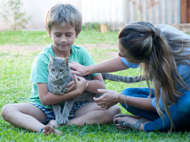 istock mother and child with pet 1192877875