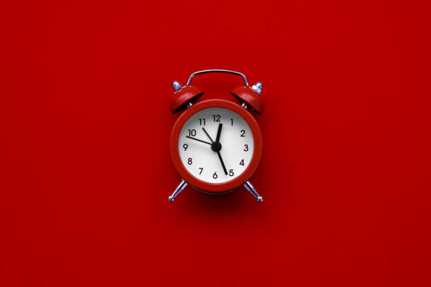 istock Alarm clock on red background. Top view. Flat lay 1192878077