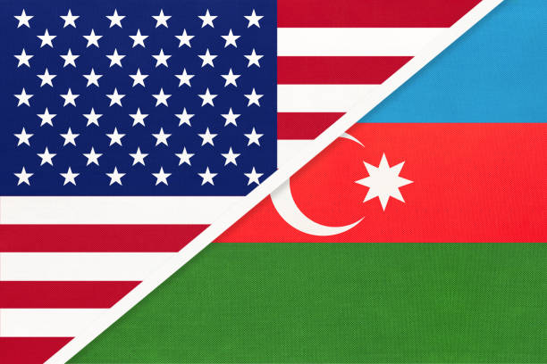 istock USA vs Azerbaijan national flag from textile. Relationship between two american and asian countries. 1192880837