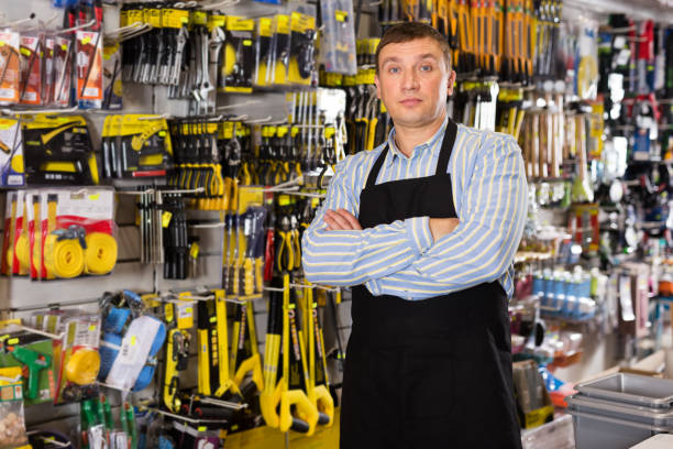 istock Male seller with tools in store 1192882312