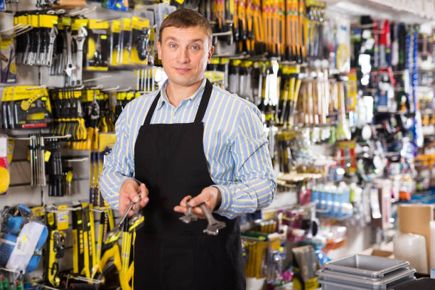 istock Male seller with tools in store 1192882330