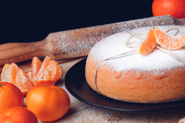 Homemade orange cake with ingredients stock photo