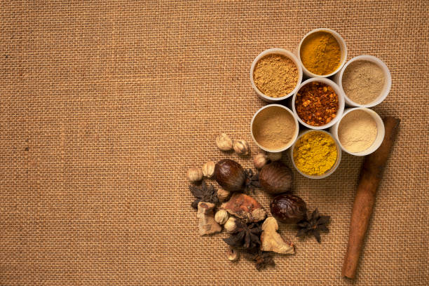 istock Top view mix spices and herbs different on sackcloth background with copy space for design healthy lifestyle, spices, herbs or foods and  massage aromatherapy content. 1192886733