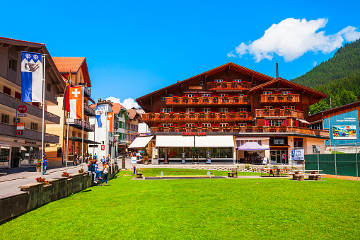 WENGEN, SWITZERLAND - JULY 14, 2019: Traditional local houses in Wengen village in the Interlaken district in the Bern canton of Switzerland