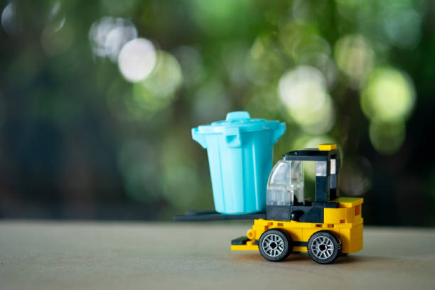 Yellow forklift toy load miniature blue plastic garbage bin