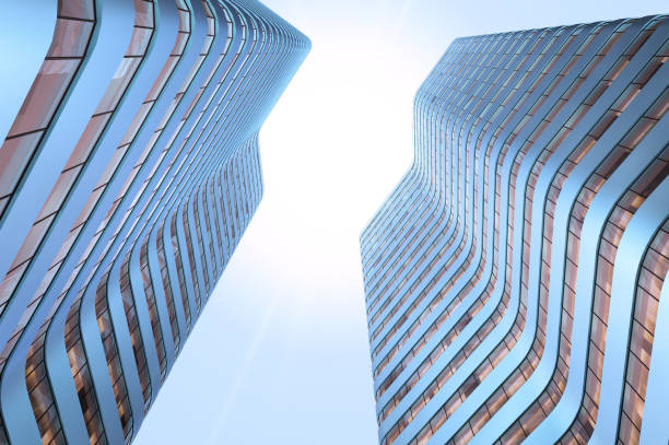istock two identical skyscrapers in blue tint bottom view 1192892970