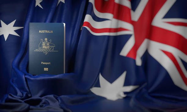 australian passport on the flag of the australia. getting a australian passport,  naturalization and immigration concept. - emigration and immigration global communications passport australia imagens e fotografias de stock