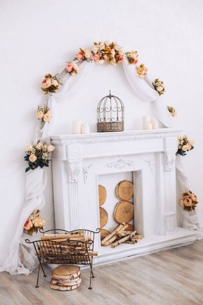 istock Interior with a beautiful decorative white fireplace and wood. 1192893934