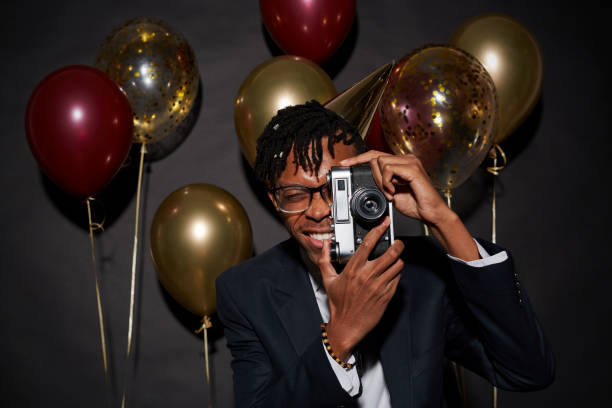 istock Trendy African Man Posing at Party 1192895366