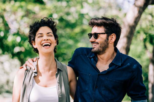 istock Happy couple enjoying in park during weekend 1192895768