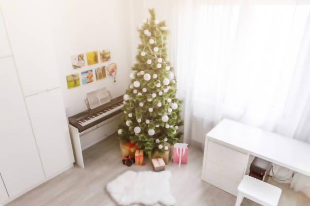 istock Beautiful holdiay decorated room with Christmas tree with presents under it 1192895832