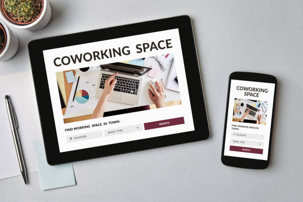 istock Coworking space concept on tablet and smartphone screen 1192897189