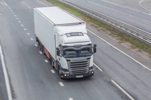 istock truck moves on highway 1192897876