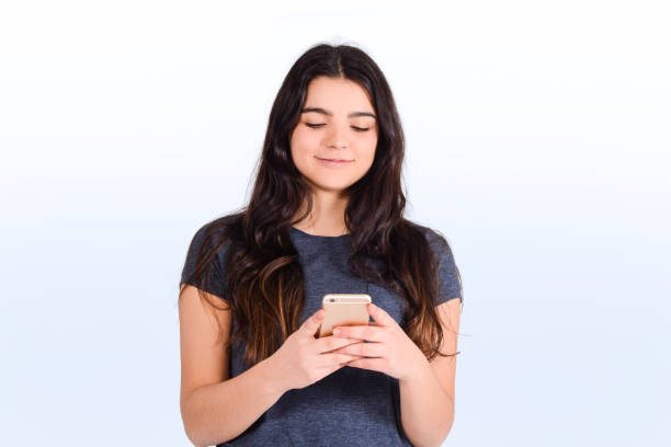 istock Young woman using her smartphone. Indoor. 1192899396