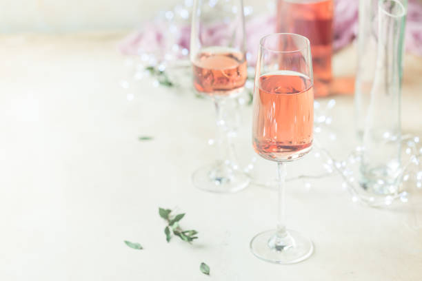 istock Two glasses and bottle of rose wine 1192899576