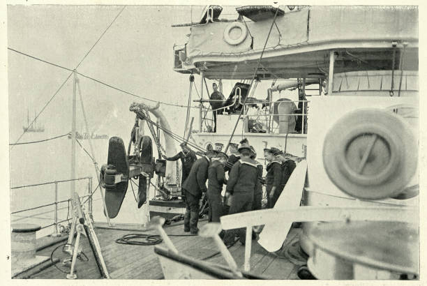 istock Sailors stowing anchor, Royal navy cruiser HMS Theseus 1192900100