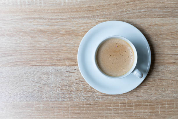 istock Coffee in white cup on wooden background, Breakfast concept 1192901848