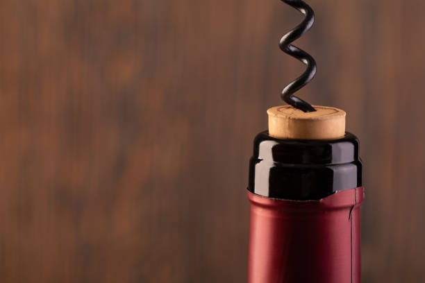 Corkscrew and bottle of wine
