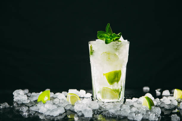 istock Mojito cocktail on black background 1192903798