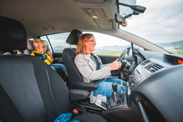 istock Mother and her Children in a Car 1192907117