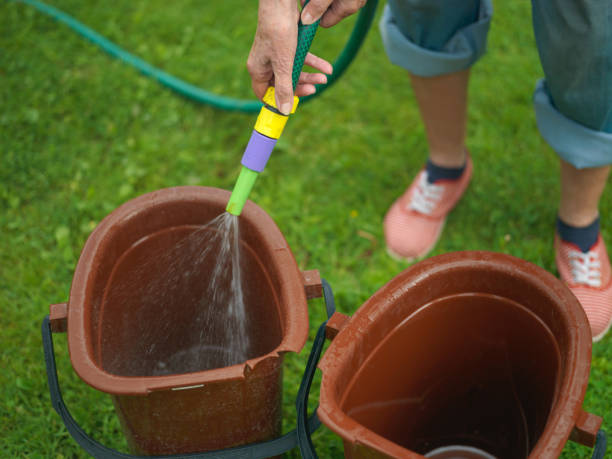 istock Woman washing two plastic buckets 1192907221