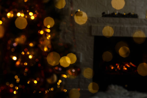 istock blur light celebration on christmas tree with white wall background 1192907325