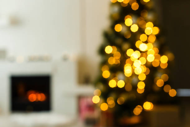 istock blur light celebration on christmas tree with white wall background 1192907460