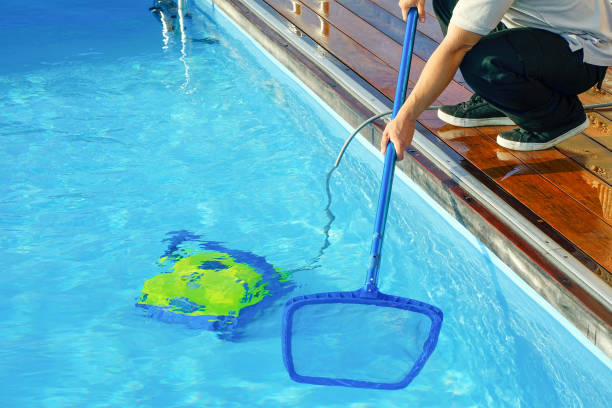 istock Hotel staff worker cleaning the pool 1192908580