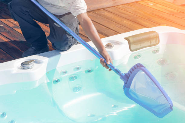 istock Hotel staff worker cleaning the pool 1192908595