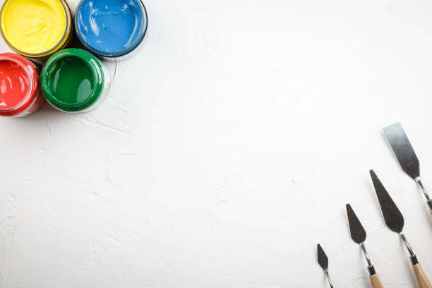 istock colored paints and palette knives 1192910598