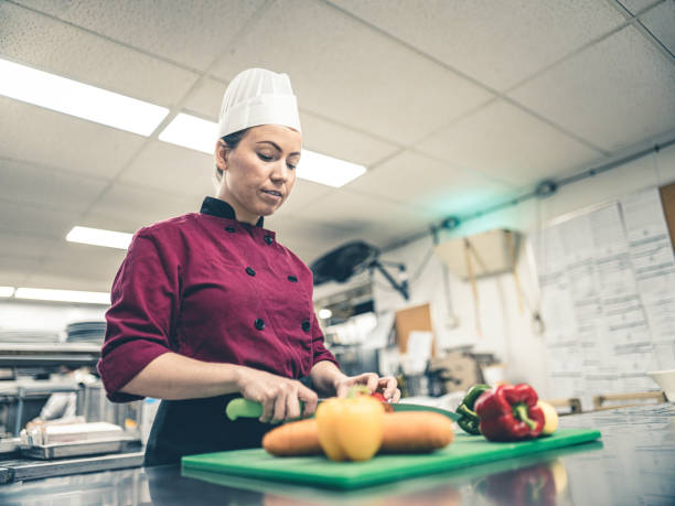 istock Female Chef working in industrial kitchen 1192914254