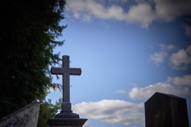 istock Old cross at a cemetery 1192915041