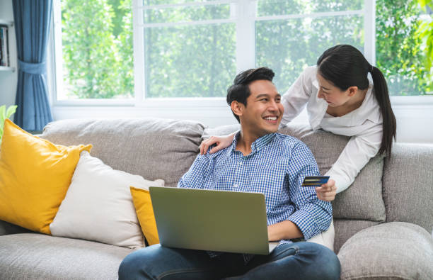 Happy Smiling Couple with Online Shopping Using Credit Card stock photo