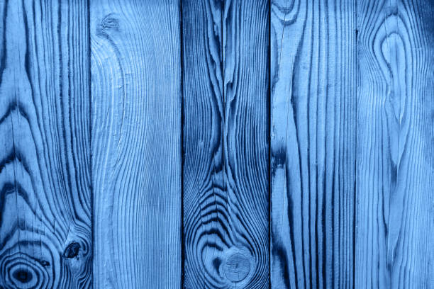 istock Natural old wooden plank background toned blue color. 1192916954