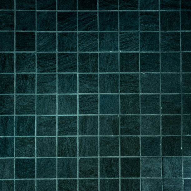 istock Small black and green stone tiles on floor 1192921605