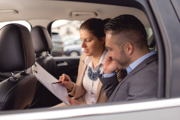 istock Young man buys a car on a car lot 1192921719