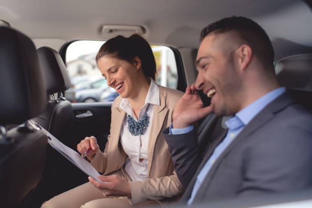 istock Young man buys a car on a car lot 1192921849