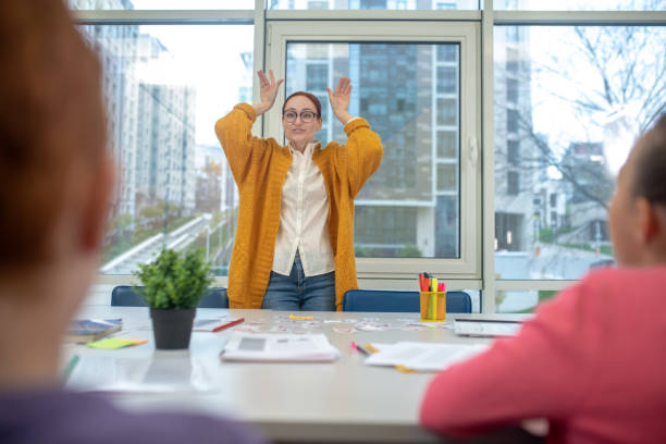 istock Teacher playing with the children in class 1192924276