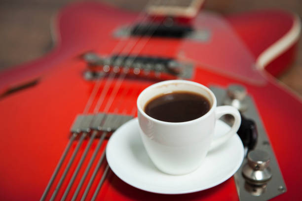 istock cup of coffee on guitar 1192925622