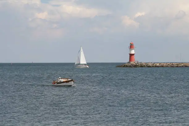 boats, sailboats and lighthouse, coastline, warnemuende, rostock, germany,