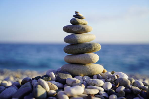 istock zen stones with a sea view behind 1192927594