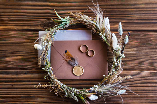 istock Wedding rings, wedding accessories in rustic style. invitation, bride�s wreath. 1192927846