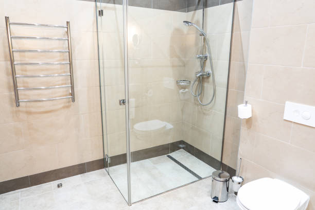 istock Glass shower walk in cabin in modern interior 1192928792