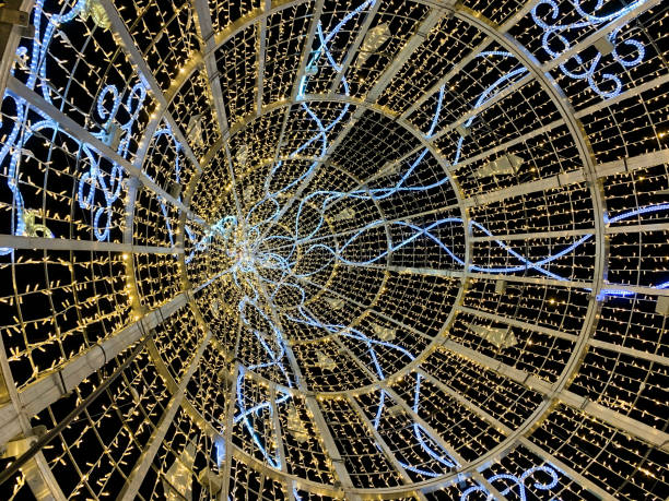 istock Inside of geometric and colorful Christmas lights tree 1192929255