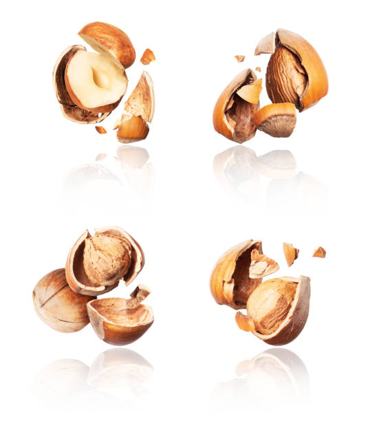 istock Group of crushed hazelnuts close-up on a white background 1192930616