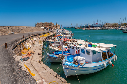 Cala Figuera, Spain -April 20, 2024: Fishing vessels moored at Cala Figuera's harbor, located in a charming bay. This beautiful harbor in southeastern Mallorca is a major attraction for tourists.