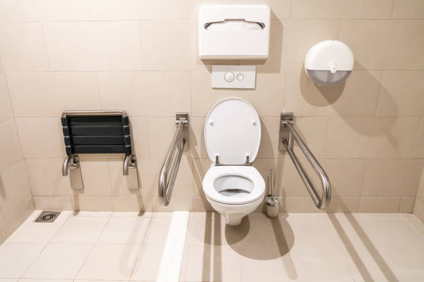 istock Public restroom for disabled people with special equipment 1192931688
