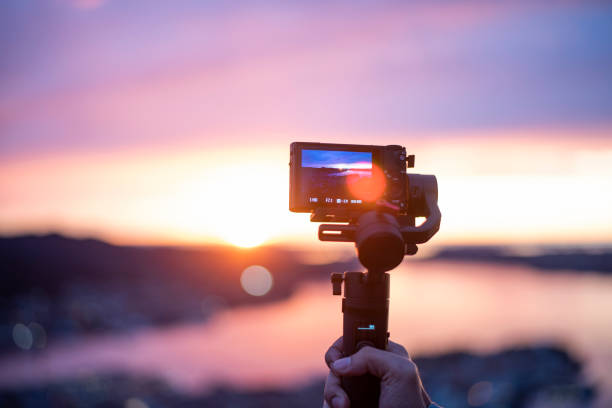 istock Camera on stabilizer is recording beautiful view at twilight 1192931811