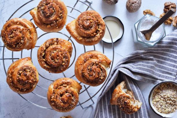 istock Snail buns with cinnamon and nuts on a concrete background. 1192931850